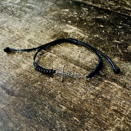 Black braided bracelet with stainless steel “Faith” cross charm, unisex Christian jewelry from Pit Bull Faith.
